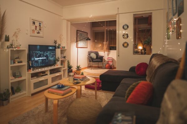 a living room filled with furniture and a flat screen tv