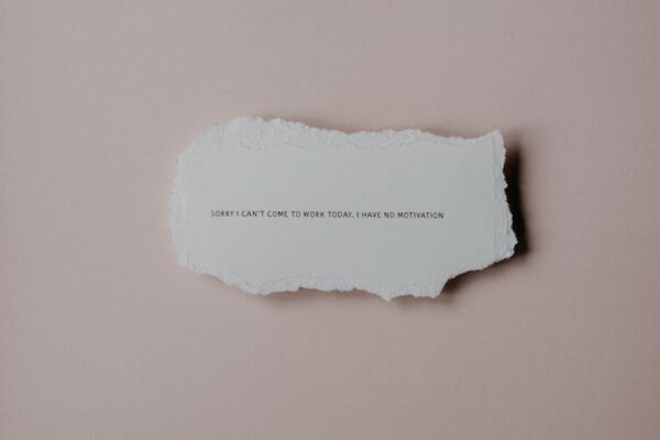 a piece of torn paper with a quote on it