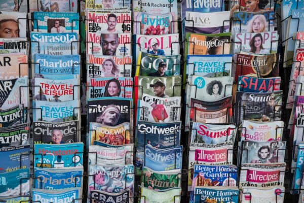 A pile of newspapers stacked on top of each other