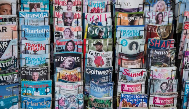 A pile of newspapers stacked on top of each other